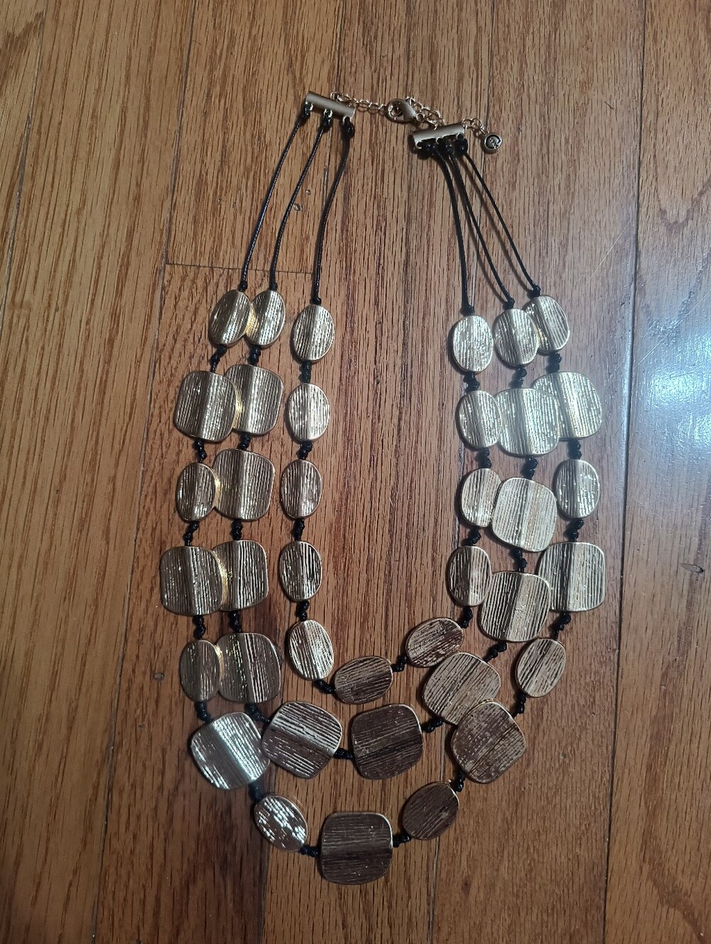 C1946 Cato metal statement necklace gold toned and black corded
